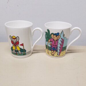 Studio Nova "Chip and Putt" Golf Playing & "Surfing Safari" Elephant Coffee Mugs